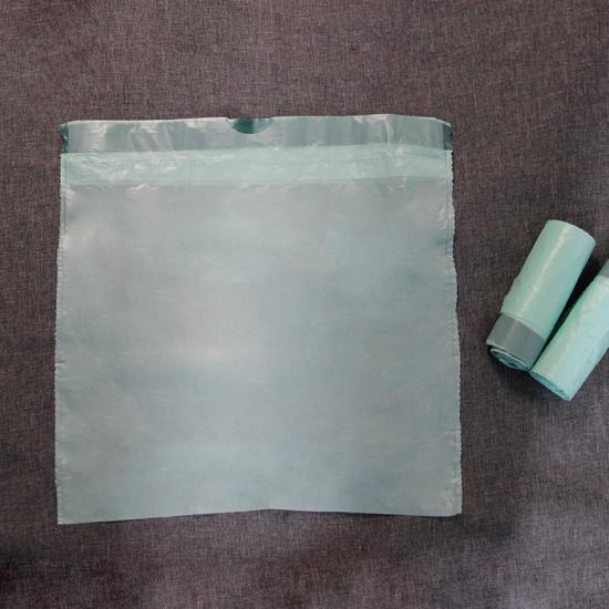 Biodegradable garbage bag with drawstring